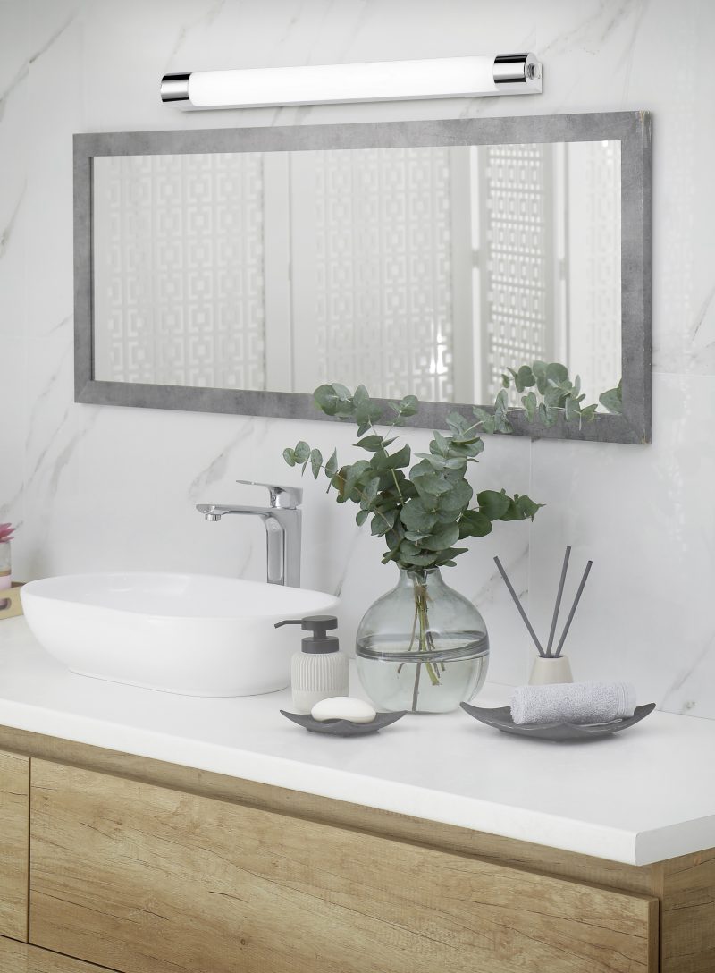 Modern bathroom interior with stylish mirror and vessel sink