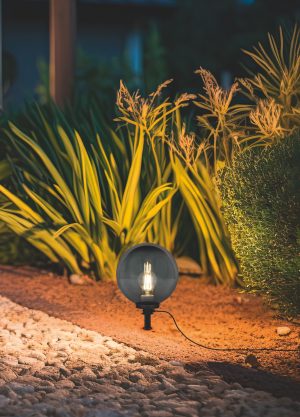 Solar-powered garden lights in a landscaped yard, showcasing aesthetic and functional use