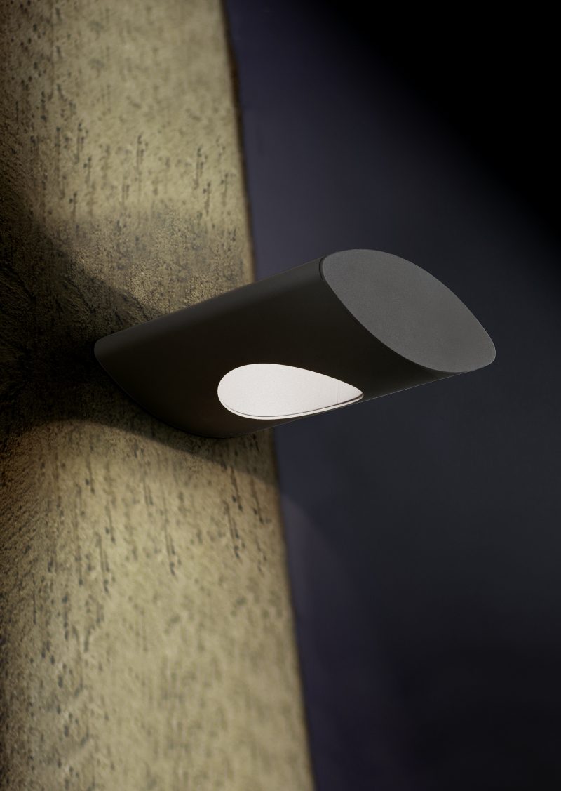 Cubical looking lantern placed on the exterior of a building during night time with copy space – Modern electrical equipment for illumination