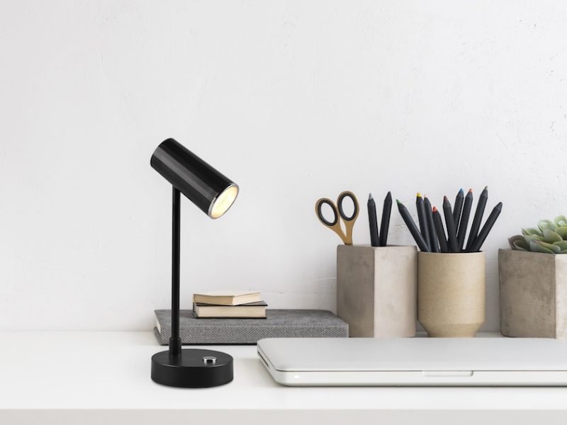 Home office, creative desk with office supplies and wall space.