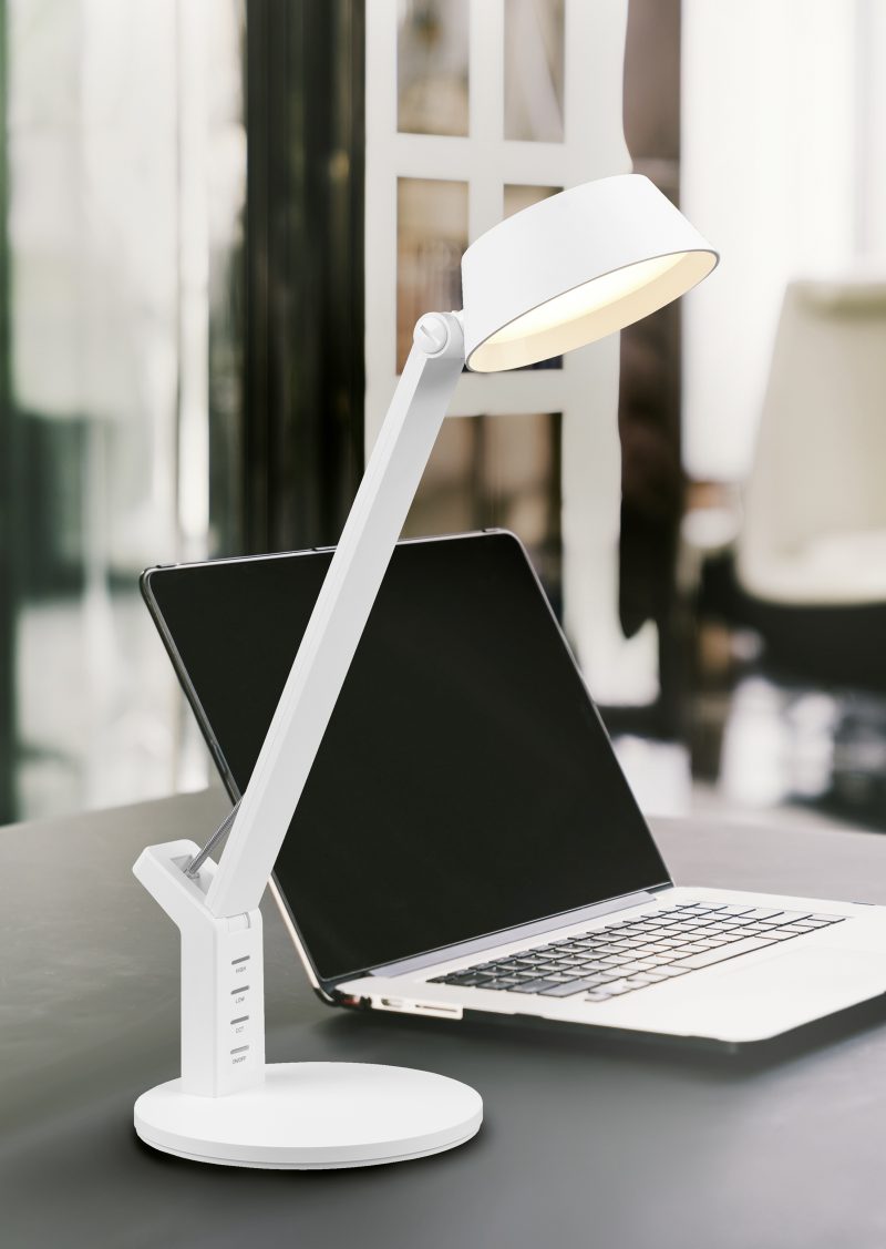 Laptop computer on work table in modern luxury contemporary office. Corporate business, internet information technology, or freelance job working at home concept